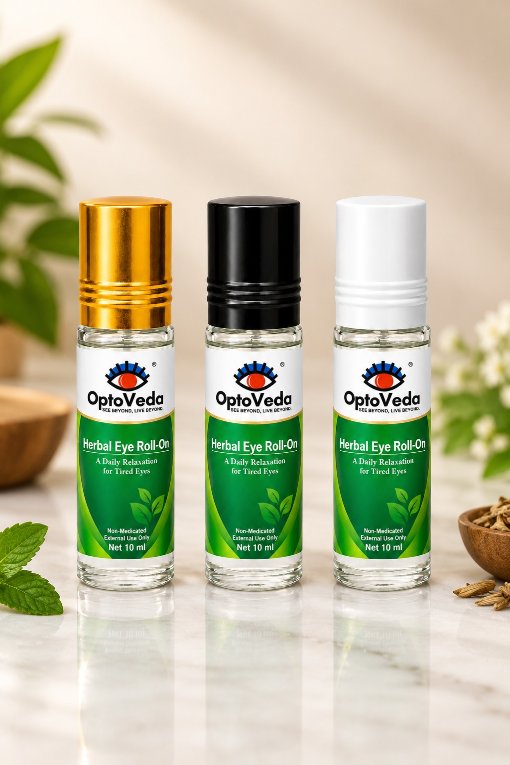 OptoVeda Herbal Eye Roll-On 10 ml bottles with gold, black and white caps